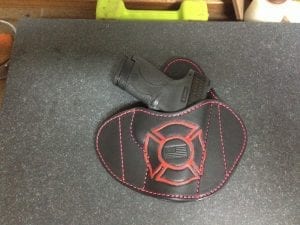 OWB Holster (Red/Black with Handgun on Table)